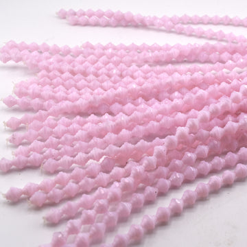 beadshopSTUDIO Vintage Glass Lt. Pink Opal Rounded Bicone w/Faceted Middle
