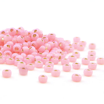 6-555-TB  Dyed Pale Pink Silver Lined Alabaster  6/0 - Beadshop.com
