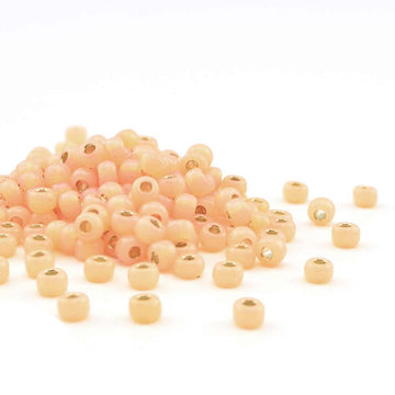 6-580-TB Dyed Pale Peach Silver Lined Alabaster  6/0 - Beadshop.com