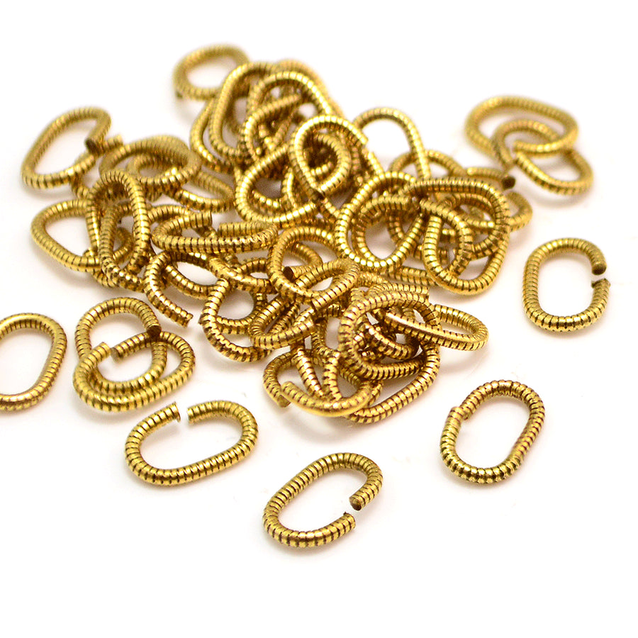 9mm/16g Oval Coil Jump Rings- Antique Gold
